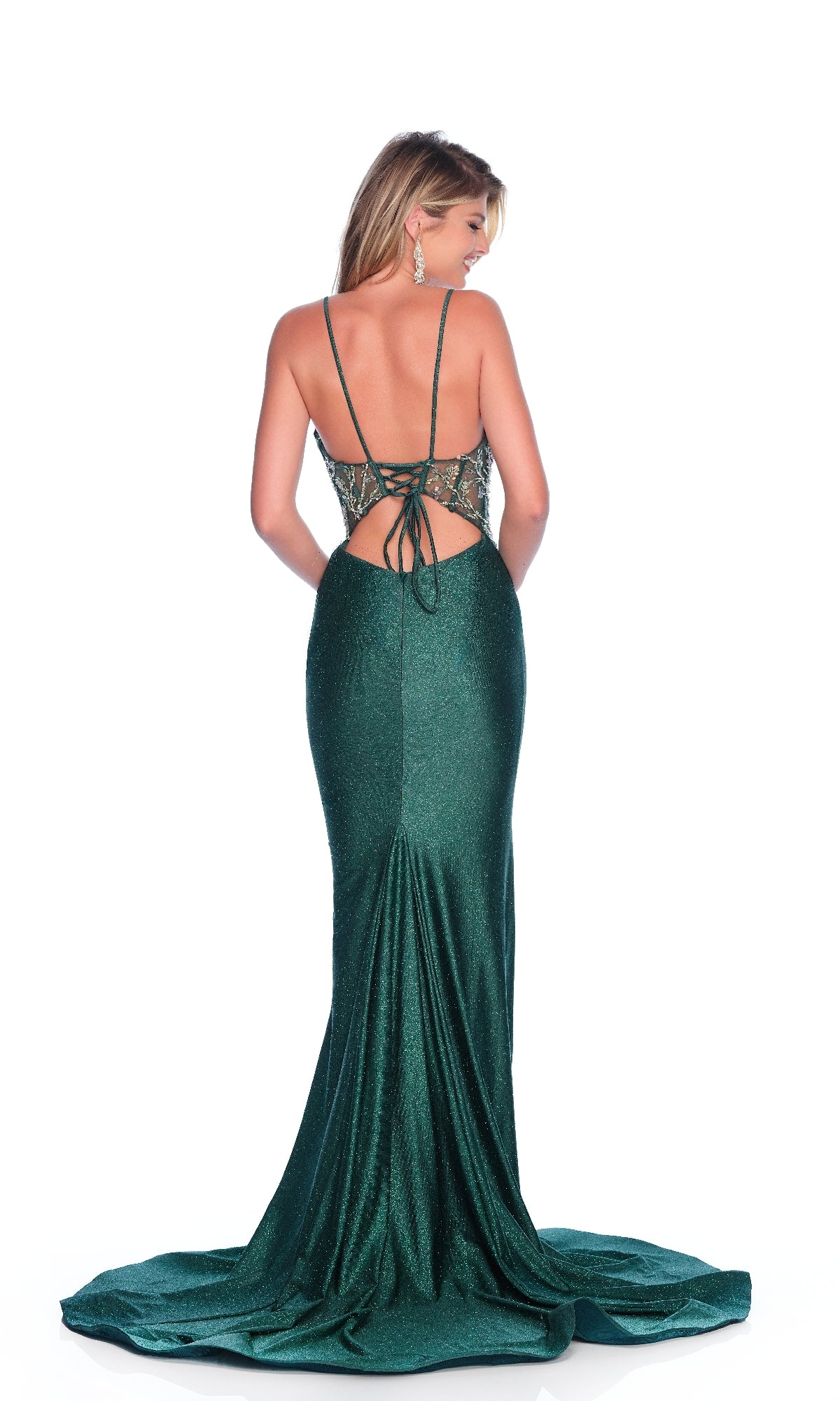 A woman faces away on a white background, wearing the Dave & Johnny 12163 Dark Green Glitter Prom Dress—floor-length, backless, with a sheer corset bodice, spaghetti straps, lace-up detail, and sparkling accents.